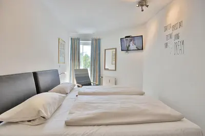 Ein Bett oder Betten in einem Zimmer der Unterkunft Residenz Ostseestrand Appartement 4