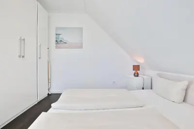 Ein Bett oder Betten in einem Zimmer der Unterkunft Parkdomizil Parkdomizil Appartement 9