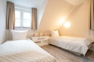 Ein Bett oder Betten in einem Zimmer der Unterkunft Muschelbank
