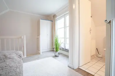 Ein Bett oder Betten in einem Zimmer der Unterkunft Muschelbank