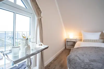 Ein Bett oder Betten in einem Zimmer der Unterkunft Muschelbank