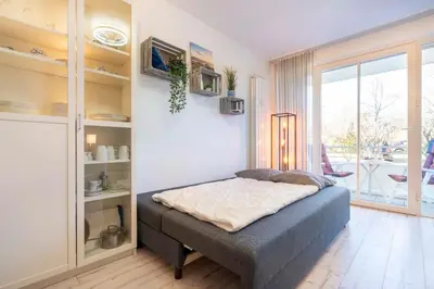 Ein Bett oder Betten in einem Zimmer der Unterkunft Ferienanlage Bergstraße 62 Ferienhaus Bergstraße 62 Appartement 8 Meeres Brise