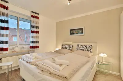 Ein Bett oder Betten in einem Zimmer der Unterkunft Haus am Wiesenweg Haus am Wiesenweg 3 Appartement 04