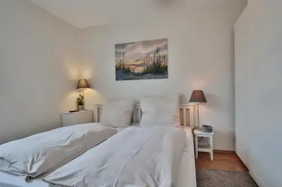 Ein Bett oder Betten in einem Zimmer der Unterkunft Strandhotel - Niendorf Strandhotel Niendorf Appartement 32