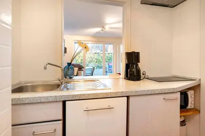 Küche/Küchenzeile in der Unterkunft Ferienhaus Bergstraße 62 Appartement Heimathafen