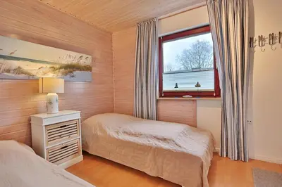 Ein Bett oder Betten in einem Zimmer der Unterkunft Ferienhaus Ahornweg Niendorf Ostsee Ahornweg Niendorf Ostsee