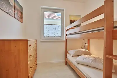 Ein Bett oder Betten in einem Zimmer der Unterkunft Ferienhaus Pommernweg Ferienwohnung Oeynhausen Appartement 3