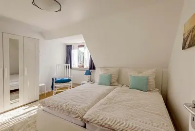 Ein Bett oder Betten in einem Zimmer der Unterkunft Haus Lubecca Ferienhaus Lubecca Appartement 01