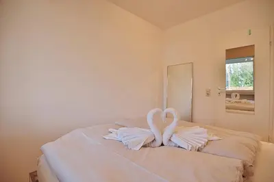 Ein Bett oder Betten in einem Zimmer der Unterkunft Haus Hubertus Haus Hubertus Appartement 05
