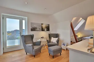 Ein Sitzbereich in der Unterkunft Haus zur Niendorfer Sonne Haus Schwalbennest