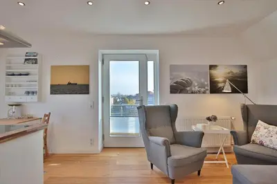 Ein Sitzbereich in der Unterkunft Haus zur Niendorfer Sonne Haus Schwalbennest