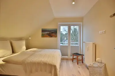 Ein Bett oder Betten in einem Zimmer der Unterkunft Appartementhaus Strandallee 206 Appartementhaus Strandallee 206 Appartement 1