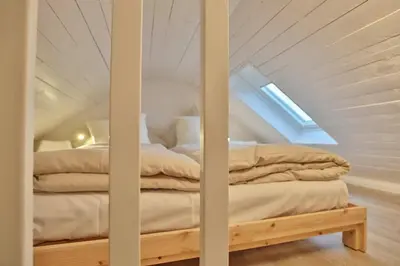 Ein Bett oder Betten in einem Zimmer der Unterkunft Appartementhaus Strandallee 206 Appartementhaus Strandallee 206 Appartement 1