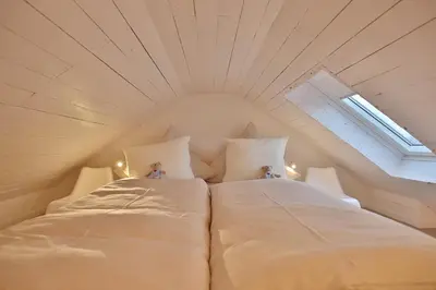 Ein Bett oder Betten in einem Zimmer der Unterkunft Appartementhaus Strandallee 206 Appartementhaus Strandallee 206 Appartement 1