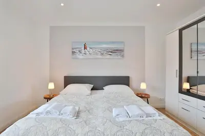 Ein Bett oder Betten in einem Zimmer der Unterkunft Res Herrenbruchstraße 7 Ferienwohnung Strandgut Appartement 1