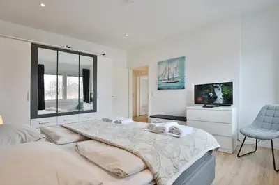 Ein Bett oder Betten in einem Zimmer der Unterkunft Res Herrenbruchstraße 7 Ferienwohnung Strandgut Appartement 1