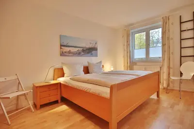 Ein Bett oder Betten in einem Zimmer der Unterkunft Wohnpark am Mühlenteich Wohnpark am Mühlenteich Appartement 09
