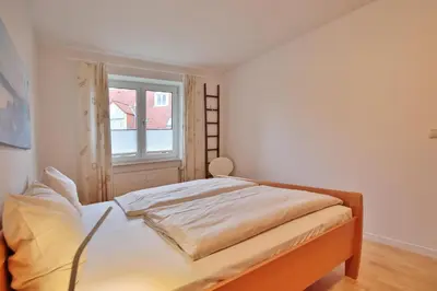 Ein Bett oder Betten in einem Zimmer der Unterkunft Wohnpark am Mühlenteich Wohnpark am Mühlenteich Appartement 09