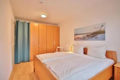 Ein Bett oder Betten in einem Zimmer der Unterkunft Wohnpark am Mühlenteich Wohnpark am Mühlenteich Appartement 09
