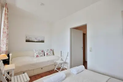 Ein Bett oder Betten in einem Zimmer der Unterkunft Poststrasse 56 Poststraße 56 Appartement 05 Strandurlaub
