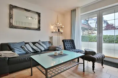 Ein Sitzbereich in der Unterkunft Sunshine-Residenz Sunshine Residenz Appartement 1 Godewind