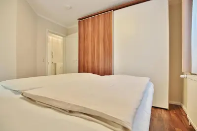 Ein Bett oder Betten in einem Zimmer der Unterkunft Domizil Strandburg Domizil Strandburg Appartement 5