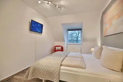 Ein Bett oder Betten in einem Zimmer der Unterkunft Domizil Strandburg Domizil Strandburg Appartement 12 Tymmendroper Türmchen