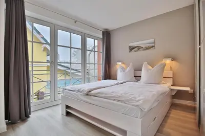 Ein Bett oder Betten in einem Zimmer der Unterkunft Haus Parkblick, Timmendorfer Strand Haus Parkblick Appartement 06