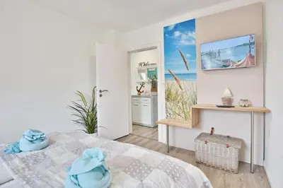 Ein Bett oder Betten in einem Zimmer der Unterkunft Haus Bergstraße 21 Haus Bergstrasse 21 Appartement 2 Glück Ahoi