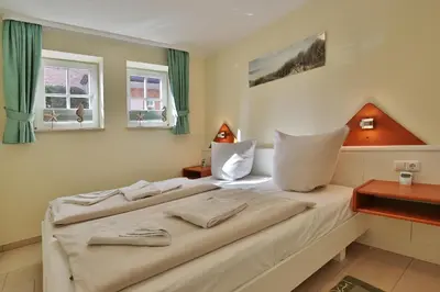 Ein Bett oder Betten in einem Zimmer der Unterkunft Haus Parkblick, Timmendorfer Strand Haus Parkblick Appartement 04