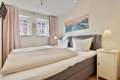 Ein Bett oder Betten in einem Zimmer der Unterkunft Haus Parkblick, Timmendorfer Strand Haus Parkblick Appartement 08