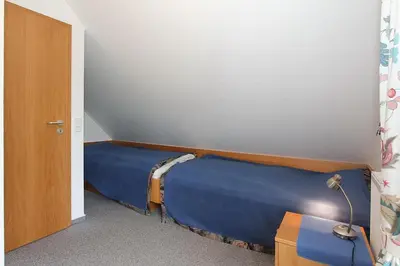 Ein Bett oder Betten in einem Zimmer der Unterkunft Haus Parkblick, Timmendorfer Strand Haus Parkblick Appartement 09