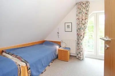 Ein Bett oder Betten in einem Zimmer der Unterkunft Haus Parkblick, Timmendorfer Strand Haus Parkblick Appartement 09
