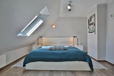 Ein Bett oder Betten in einem Zimmer der Unterkunft Haus Parkblick, Timmendorfer Strand Haus Parkblick Appartement 12