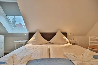 Ein Bett oder Betten in einem Zimmer der Unterkunft Im Brook 36-38 Am Elchgrund Appartement 12