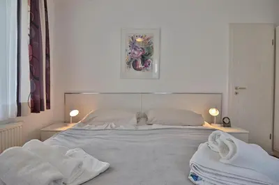 Ein Bett oder Betten in einem Zimmer der Unterkunft Domizil Gartenstraße Domizil Gartenstraße 4 Appartement 4