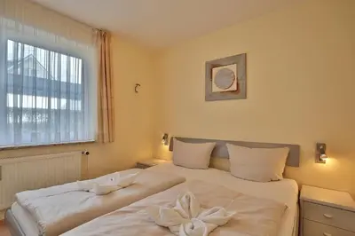 Ein Bett oder Betten in einem Zimmer der Unterkunft Gorch-Fock-Park Haus 06 Gorch-Fock-Park 6 Appartement 5