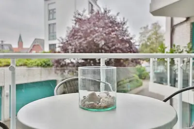 Ein Balkon oder eine Terrasse in der Unterkunft Maison Baltique Niendorf Maison Baltique Appartement 01