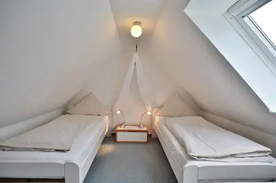 Ein Bett oder Betten in einem Zimmer der Unterkunft Am Rosenhain 9 Am Rosenhain 9 Appartement 4