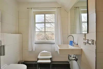 Ein Badezimmer in der Unterkunft Am Rosenhain 9 Am Rosenhain 9 Appartement 4