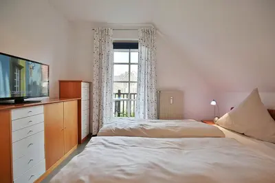 Ein Bett oder Betten in einem Zimmer der Unterkunft Am Rosenhain 9 Am Rosenhain 9 Appartement 4