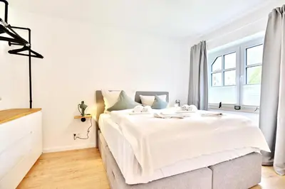 Ein Bett oder Betten in einem Zimmer der Unterkunft Am Rosenhain 23 Am Rosenhain 23 Appartement 02