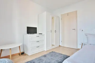 Ein Bett oder Betten in einem Zimmer der Unterkunft Residenz Wolburgstraße Residenz Wolburgstraße Appartement 2