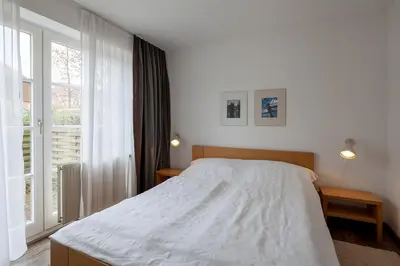 Ein Bett oder Betten in einem Zimmer der Unterkunft Am Rosenhain 6 Am Rosenhain 6 Appartement 1