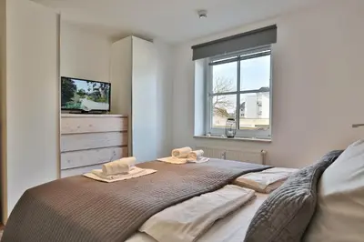 Ein Bett oder Betten in einem Zimmer der Unterkunft Maison Baltique Niendorf Maison Baltique Appartement 03