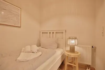 Ein Bett oder Betten in einem Zimmer der Unterkunft Moderne Strandvilla Moderne Strandvilla Appartement 4