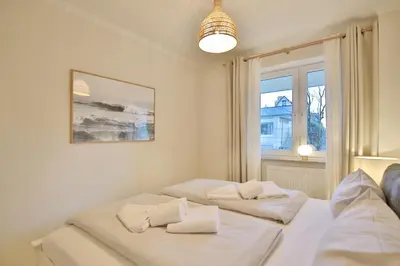Ein Bett oder Betten in einem Zimmer der Unterkunft Moderne Strandvilla Moderne Strandvilla Appartement 4
