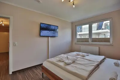 Ein Bett oder Betten in einem Zimmer der Unterkunft Residenz Herrenbruchstr Residenz Herrenbruchstraße 5 Appartement 4