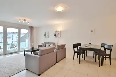 Ein Sitzbereich in der Unterkunft Villa Mér Baltique Villa Mér Baltique Appartement 13