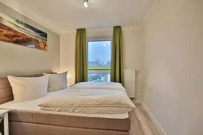 Ein Bett oder Betten in einem Zimmer der Unterkunft Domizil am Meer Domizil am Meer Appartement 14